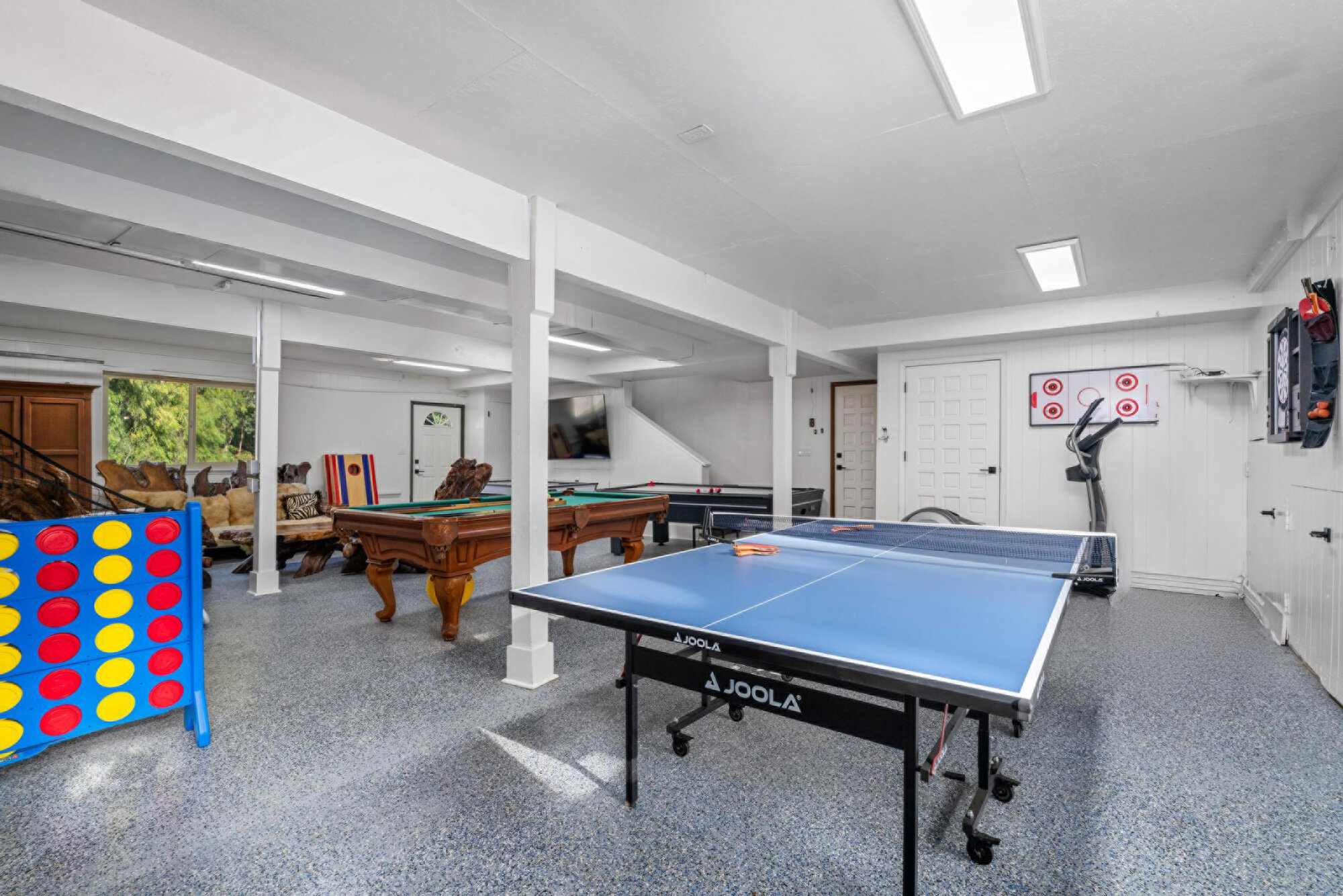 Game room with pool tables, ping pong, air hockey and giant Connect Four